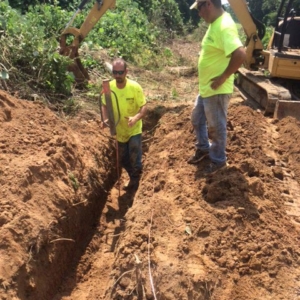 Digging a trench for cable
