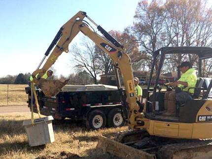 Digging a trench for underground cable